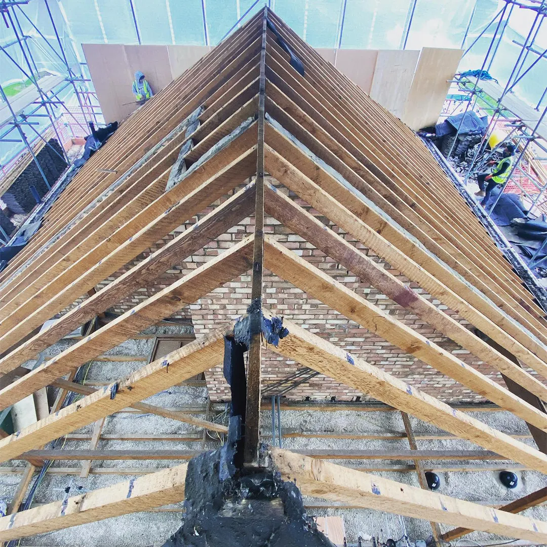 A wooden structure is being constructed in a building.