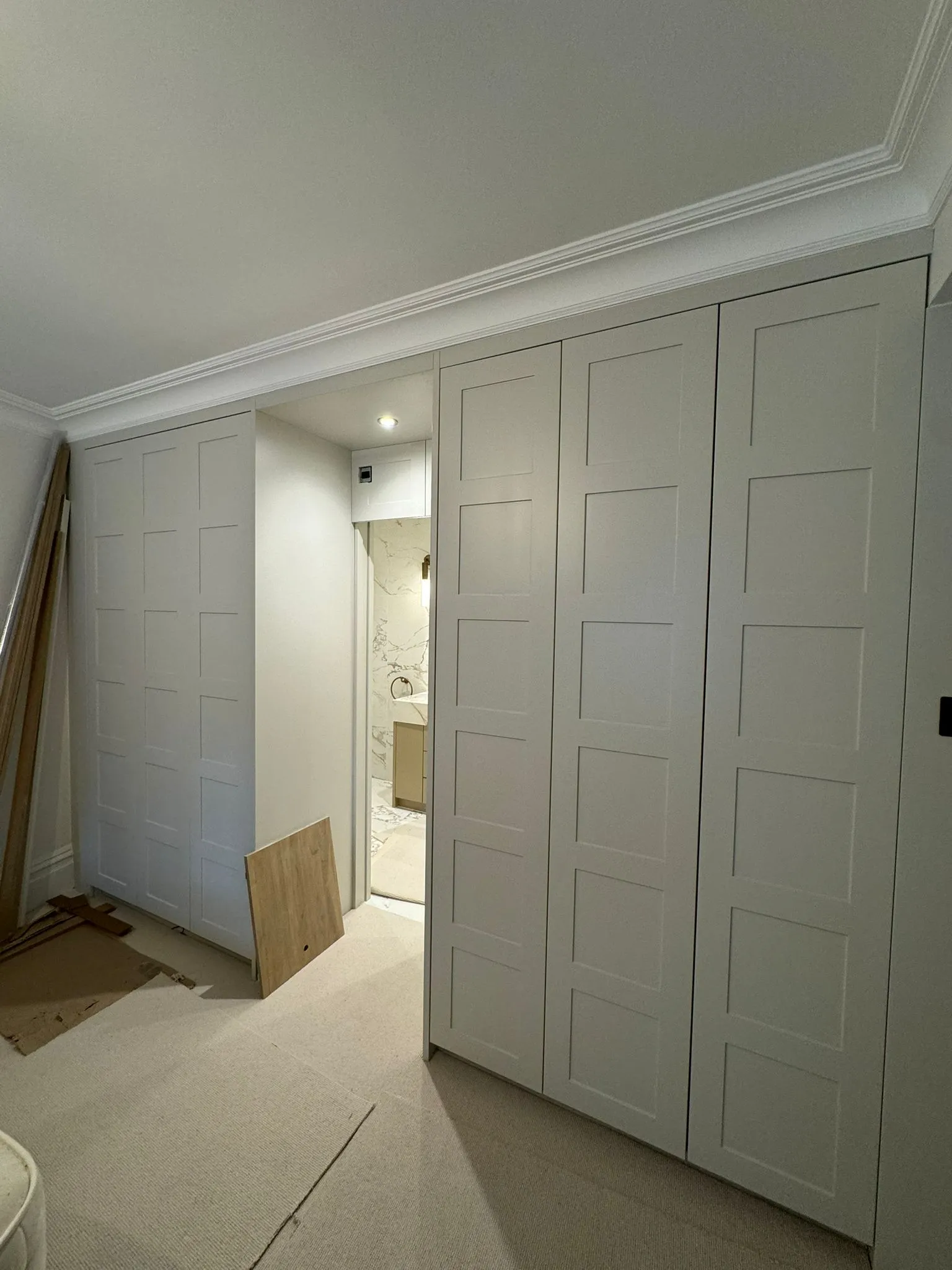 A room that has a bunch of closets in it.