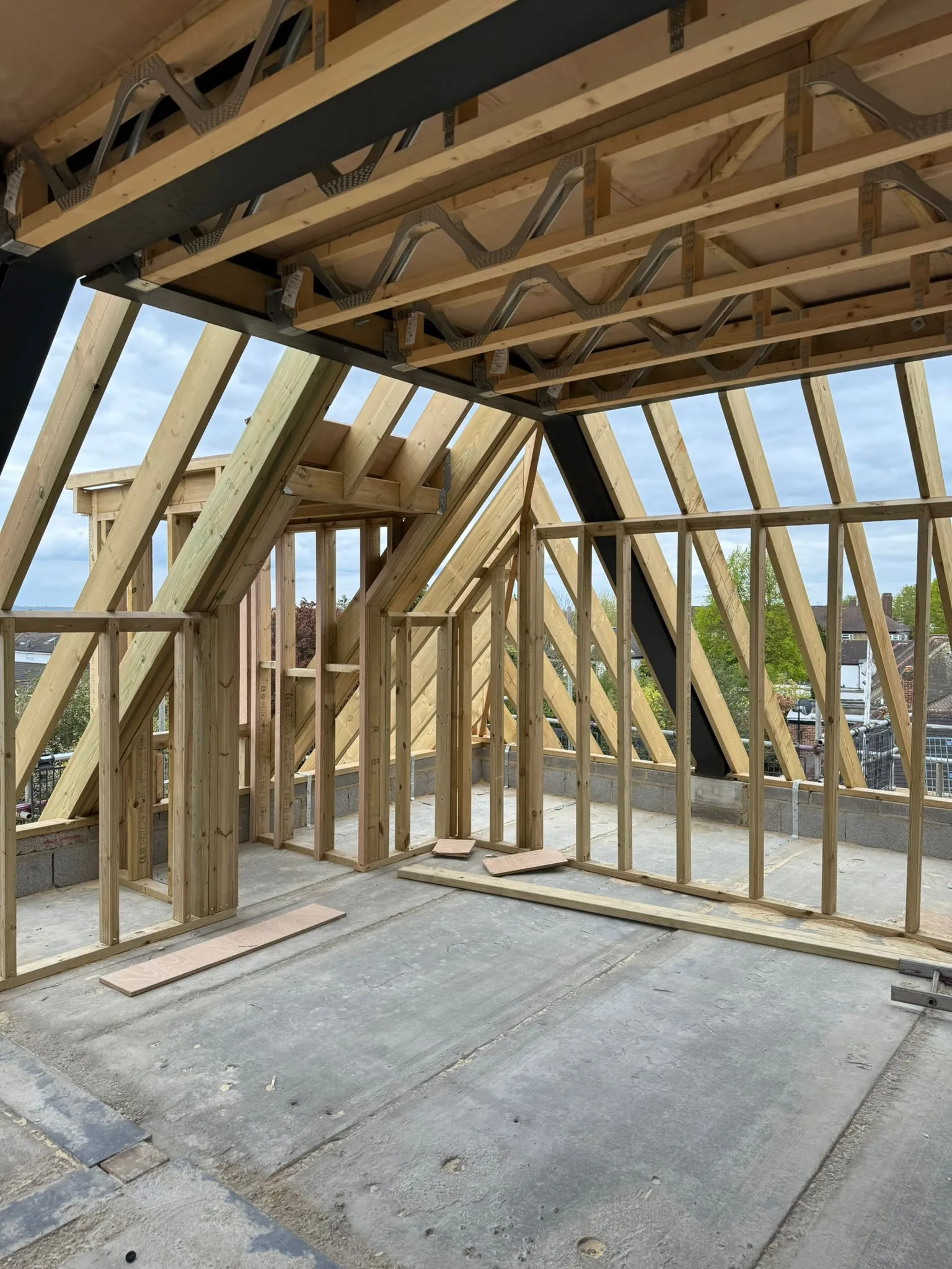 A room with a roof that is being built.
